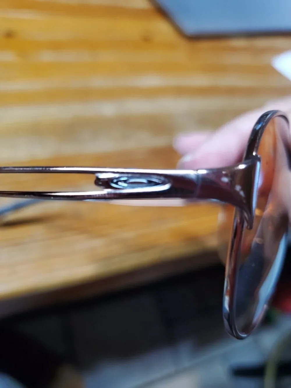 Oakley Caveat aviator sunglasses featuring a rose gold metal frame and warm brow